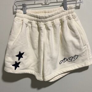 AXID Cream Shorts with Black Star Design